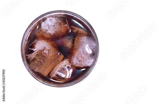 A cola glass with ice top view on white isolated background and copy space 