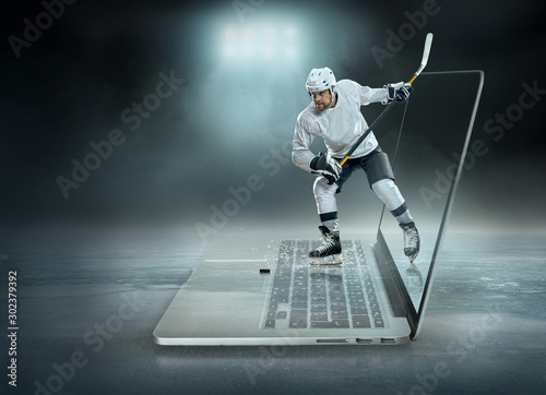 Caucassian ice hockey Players in dynamic action in a professiona © Andrii IURLOV