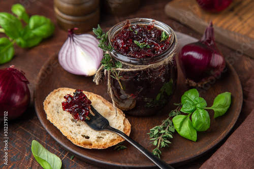 homemade red onion jam ( confiture) in a jar photo
