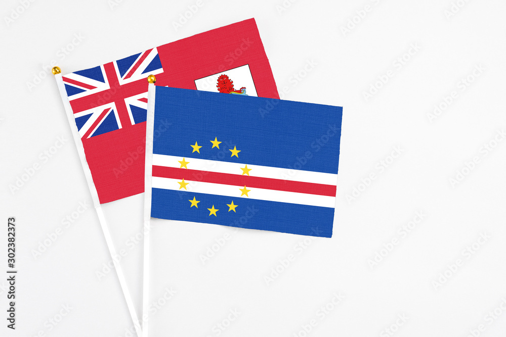 Cape Verde and Bermuda stick flags on white background. High quality fabric, miniature national flag. Peaceful global concept.White floor for copy space. Cape Verde and Bermuda stick flags on white background. High quality fabric, miniature national flag. Peaceful global concept.White floor for copy space.