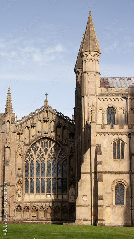Tower and spire on beautiful cathedral in romanesque and gothic style architecture church, duomo in Ely England vertical photo 