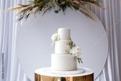 Magnificent bisexual cake for brides and guests photo