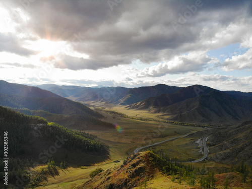 Beautiful views of the mountains and forests of Altai in the fall on a sunny day. Aerial view