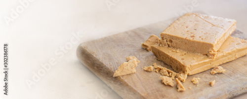Turron, traditional Christmas dessert in Spain and Italy.  Almond nougat typically made of almond and honey.Large image for banner with copy space photo