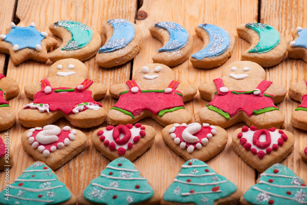 beautiful New Year and Christmas colorful cookies photographed on a wooden background