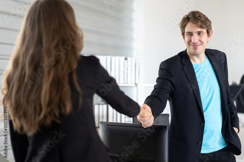 Two bussiness leader man and women shaking hands, Work to completion.Bussiness concept.