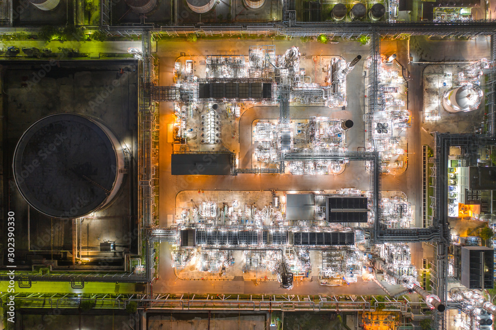 Aerial view of Oil and gas industry - refinery at twilight with chemical storage tank. Aerial view of Oil and gas industry - refinery at twilight with chemical storage tank.