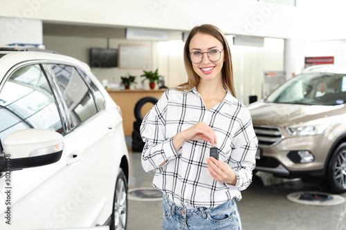 Happy woman with key from n...