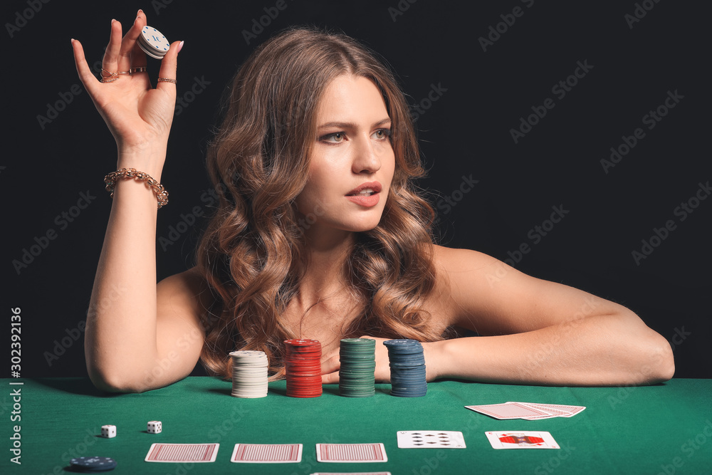 Female poker player at table in casino Female poker player at table in casino