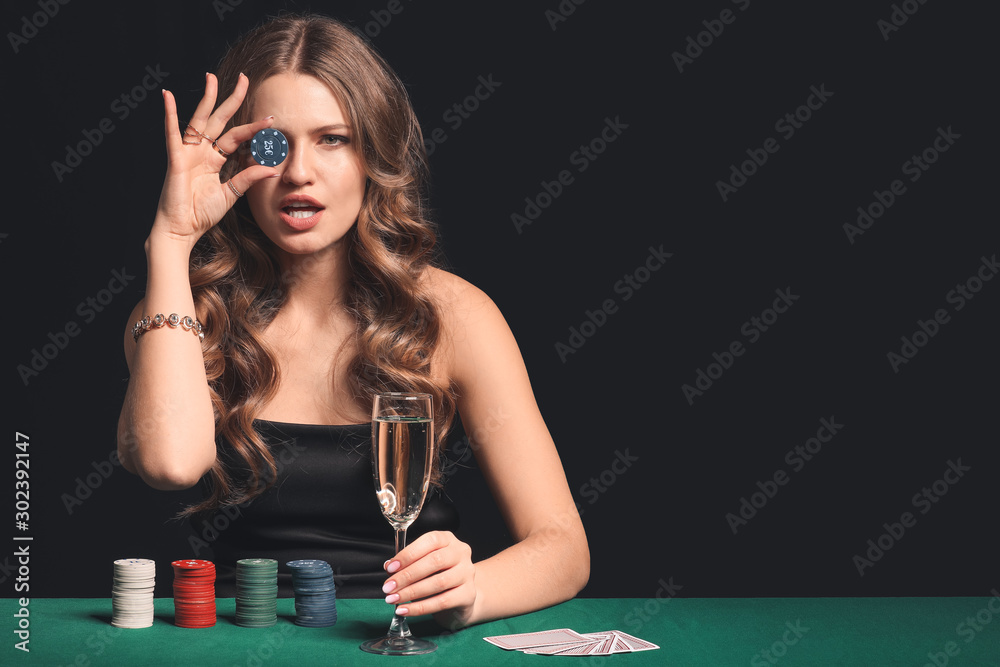 Female poker player at table in casino Female poker player at table in casino
