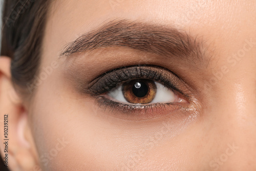 Fototapeta Naklejka Na Ścianę i Meble -  Young woman with beautiful eyebrows, closeup