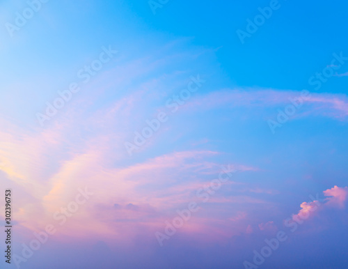 Fantasy abstract background, Colorful sunlight on blue sky and white moving cloud before sunset © paahboobkk