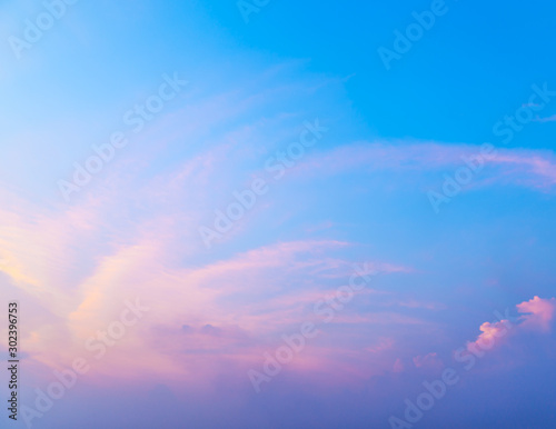 Fantasy abstract background, Colorful sunlight on blue sky and white moving cloud before sunset