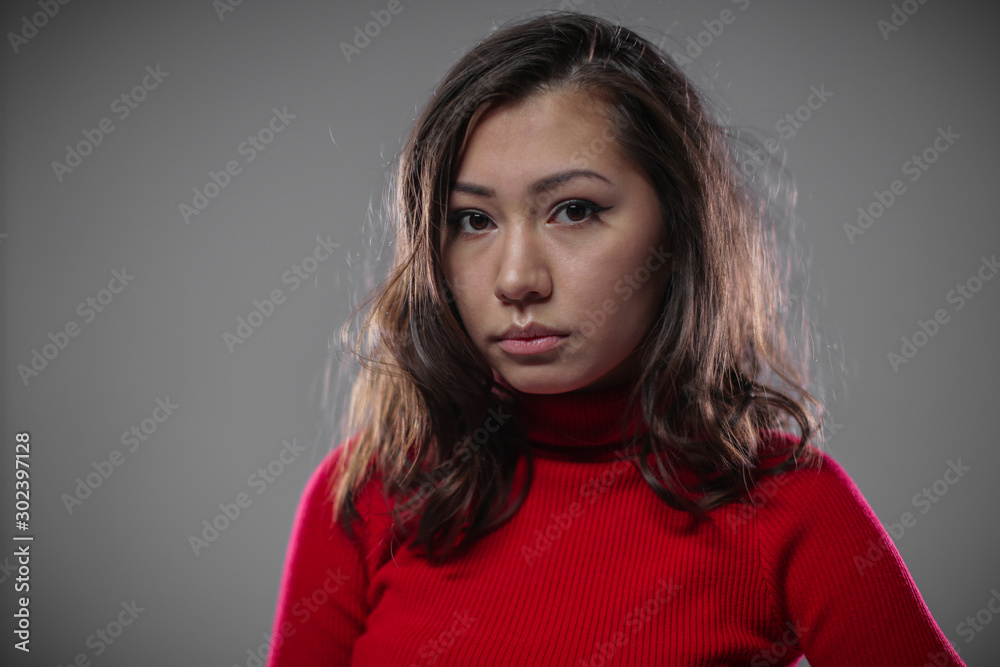 The woman looks at the camera with an innocent look, like a fawn. The woman looks at the camera with an innocent look, like a fawn.