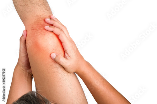 The human hands touching on the knee having pain from muscle strain  He touches the red dot with painful and suffers on isolated white background with clipping path.
