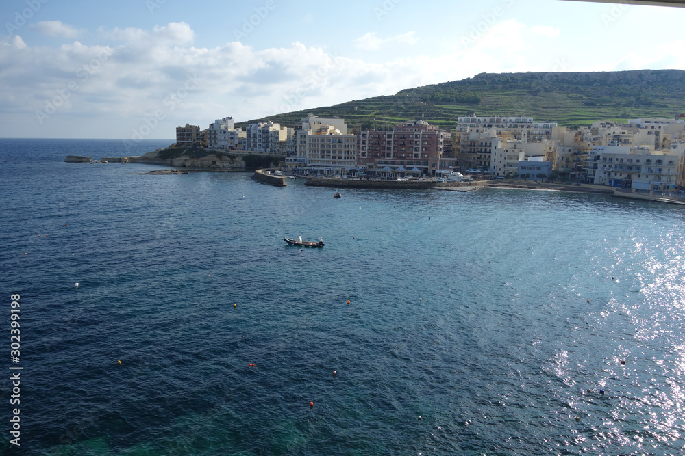 Naklejka premium View of the bay of Marsalforn, a town on the north coast of Gozo, Malta, the second largest island of the Maltese archipelago