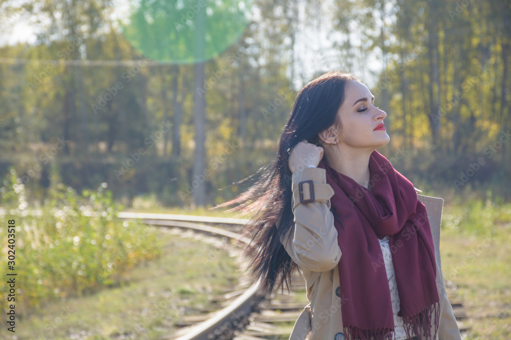 Young, caucasian girl walking on the railway. Railroad workers doing their job. Rail advertising Young, caucasian girl walking on the railway. Railroad workers doing their job. Rail advertising
