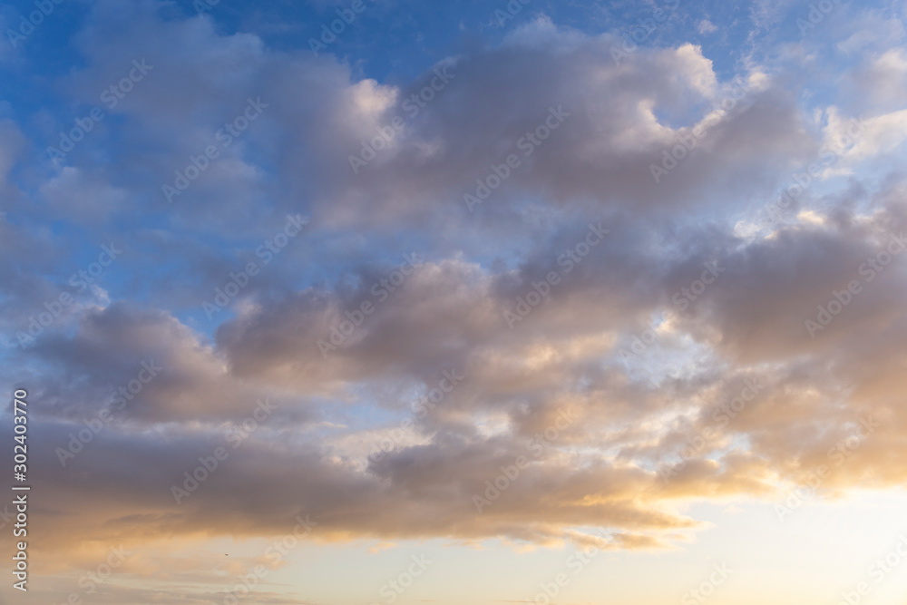 blue sky with white clouds at sunrise