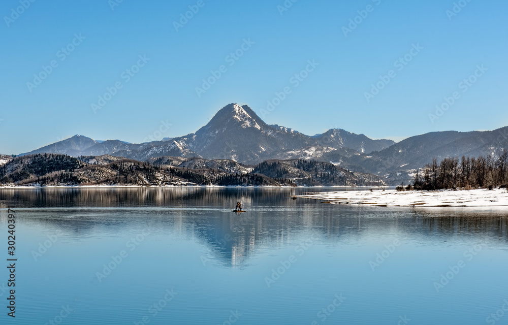 Snowy landscapes. Water bike on the Lake at winter. Wintry leisures and activities. Snowy landscapes. Water bike on the Lake at winter. Wintry leisures and activities.