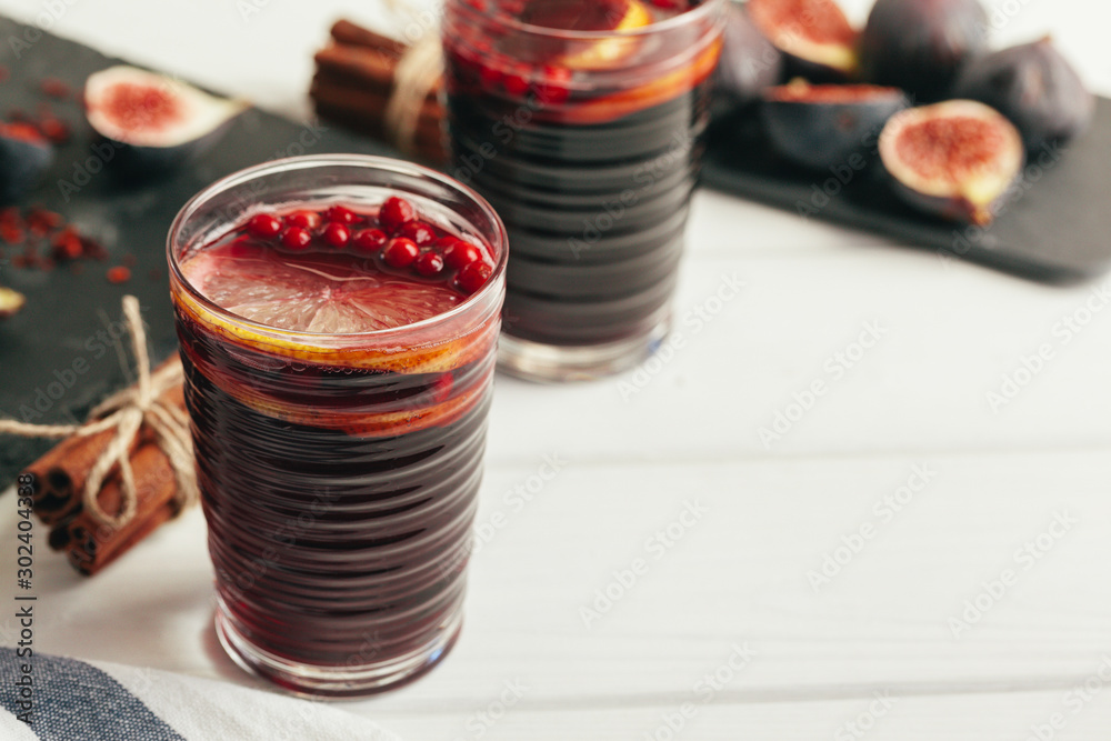 New Year composition with mulled wine on dark wooden background New Year composition with mulled wine on dark wooden background