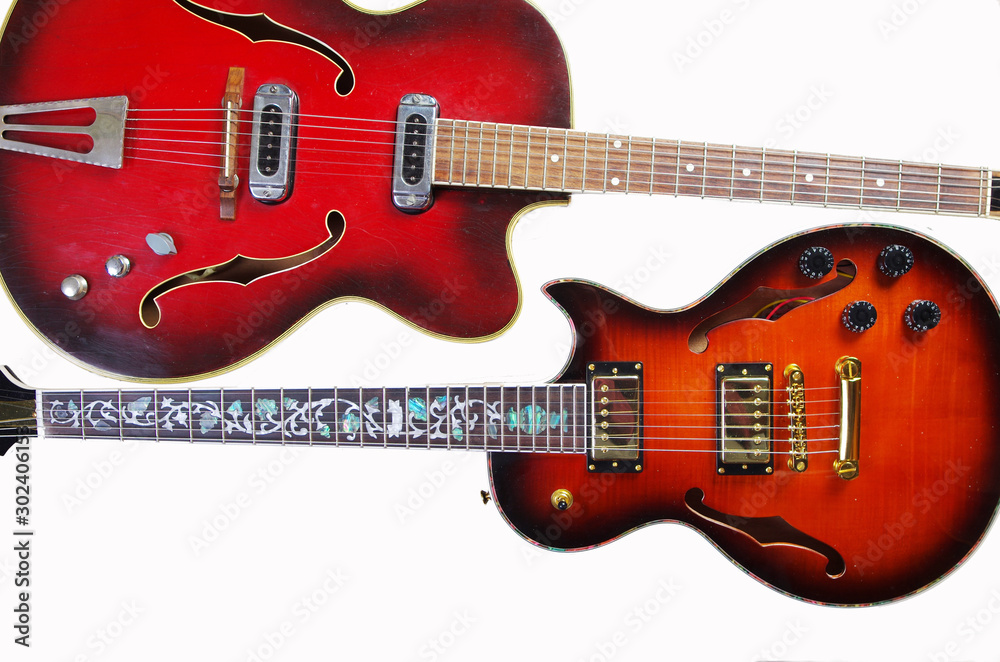 Fototapeta premium Two electric guitars on white. Isolated on white.