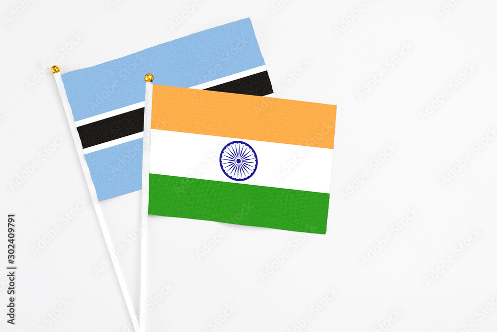 India and Botswana stick flags on white background. High quality fabric, miniature national flag. Peaceful global concept.White floor for copy space. India and Botswana stick flags on white background. High quality fabric, miniature national flag. Peaceful global concept.White floor for copy space.