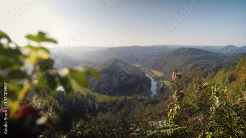 Ardennes Belgium with meandering horsshoe river. Camera focus pull and tracking. photo