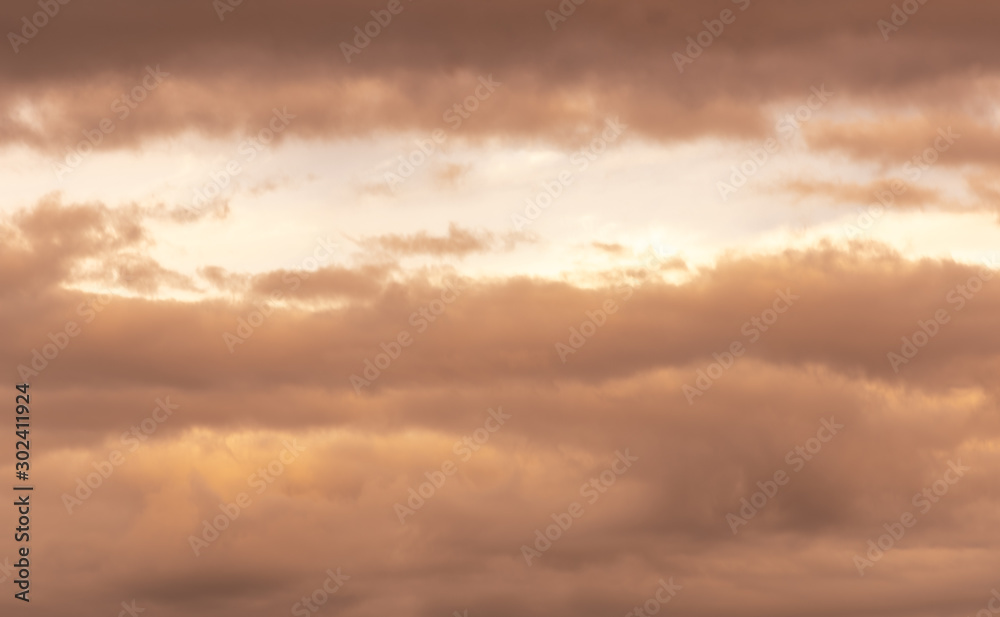 Sky and clouds in autumn season in orange colors.