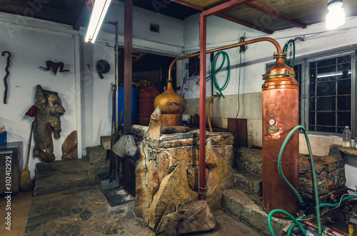Fotografie Traditional distillation of raki - tsipouro in Crete - kazani .