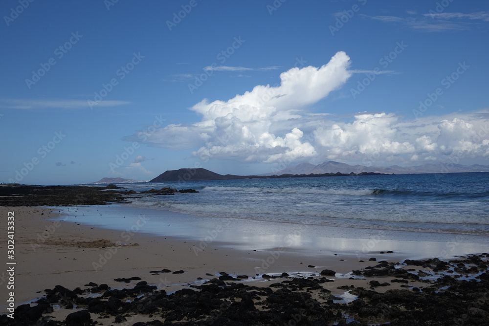 Cloads over Lobos Island viewed from the Natural park of  Corralejo in Fuerteventura,La Oliva,Canary Islands,Spain