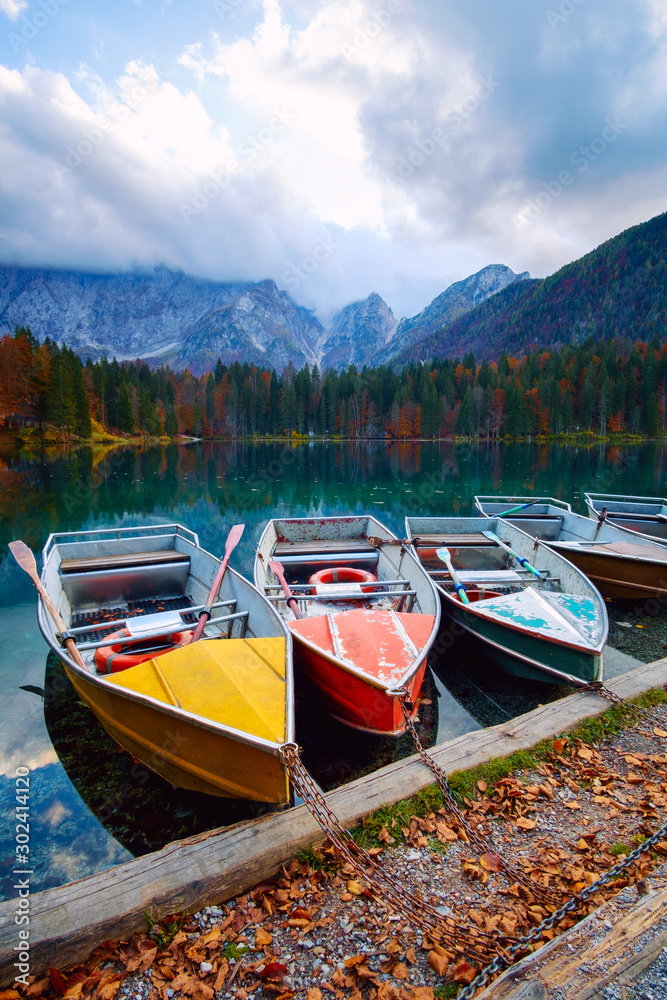 Alpine lake and colorful boats, Lake Fusine,Italy