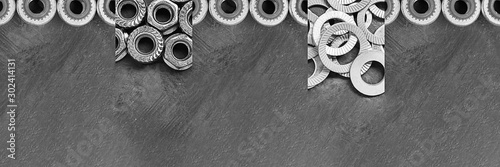 Fasteners collage. Horizontal long banner with different kinds of screws, rivet nuts. Black and white metal details. Close up. Modern technology, ingineering, industry. photo