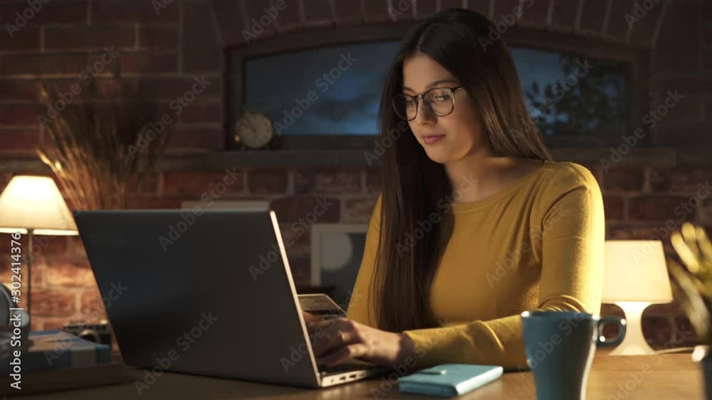Woman doing online shopping at home Woman doing online shopping at home