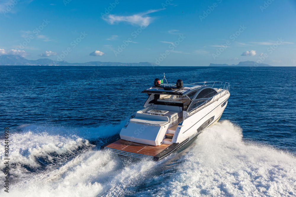 Naklejka premium luxury motor yacht in navigation, aerial view