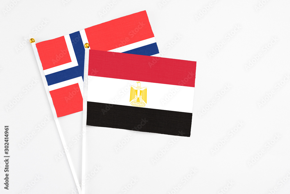 Egypt and Bouvet Islands stick flags on white background. High quality fabric, miniature national flag. Peaceful global concept.White floor for copy space. Egypt and Bouvet Islands stick flags on white background. High quality fabric, miniature national flag. Peaceful global concept.White floor for copy space.
