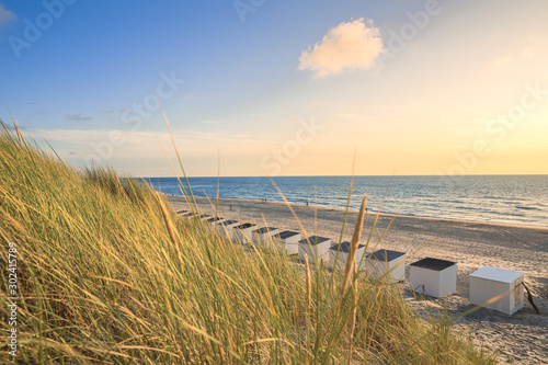 Beach Cabins And High Dunes With Grass At Texel Netherlands photo
