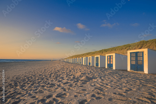 Beach Cabins And High Dunes With Grass At Texel Netherlands photo