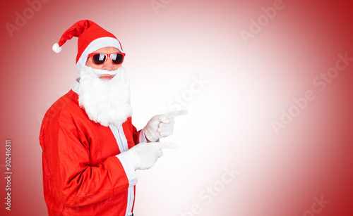 santa claus with sunglasses and hat and copyspace