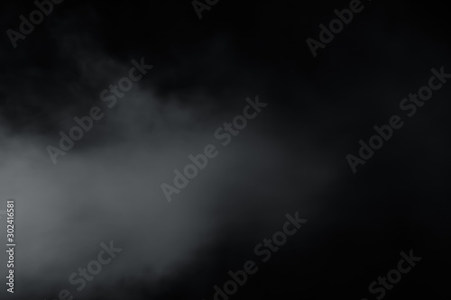 Smoke come from left side on black background. Like soft blur fog