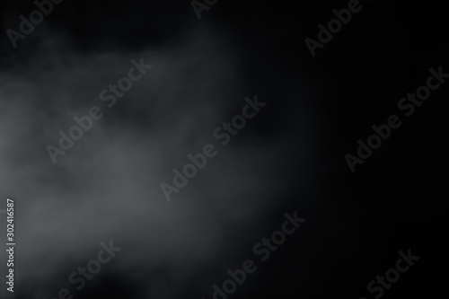 Smoke come from left side on black background. Like soft blur fog