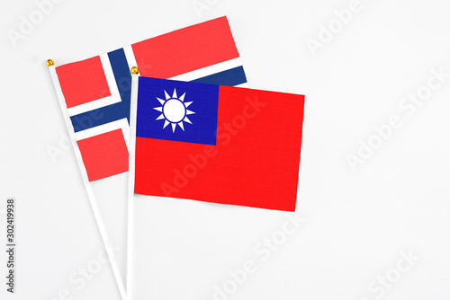 Taiwan and Bouvet Islands stick flags on white background. High quality fabric, miniature national flag. Peaceful global concept.White floor for copy space. Free Download Taiwan and Bouvet Islands stick flags on white background. High quality fabric, miniature national flag. Peaceful global concept.White floor for copy space. - GFXLoad