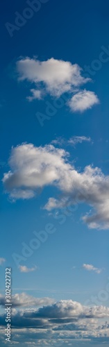 Fantastic soft clouds against blue sky, natural composition - panorama