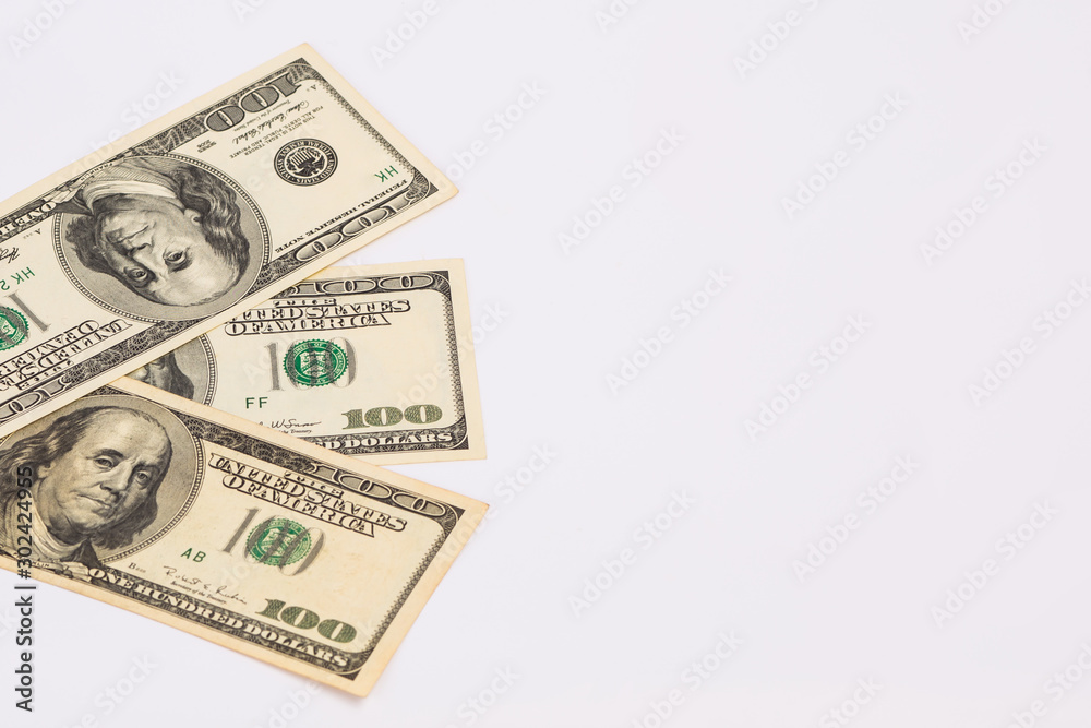 Three hundred dollar bills. American banknotes on a white background. Three hundred dollar bills. American banknotes on a white background.