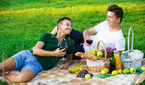 men enjoying picnic outdoors