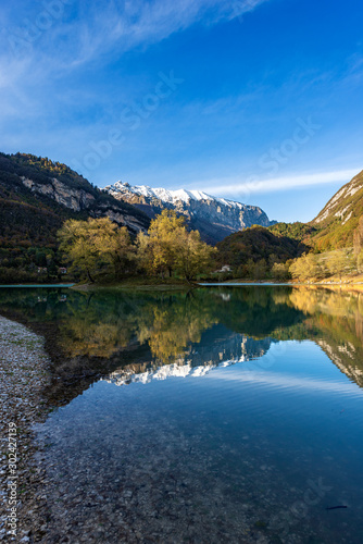 Lago di Tenno in autumn  small beautiful lake with reflections in Italian alps  Trento province  Trentino-Alto Adige  Italy  Europe