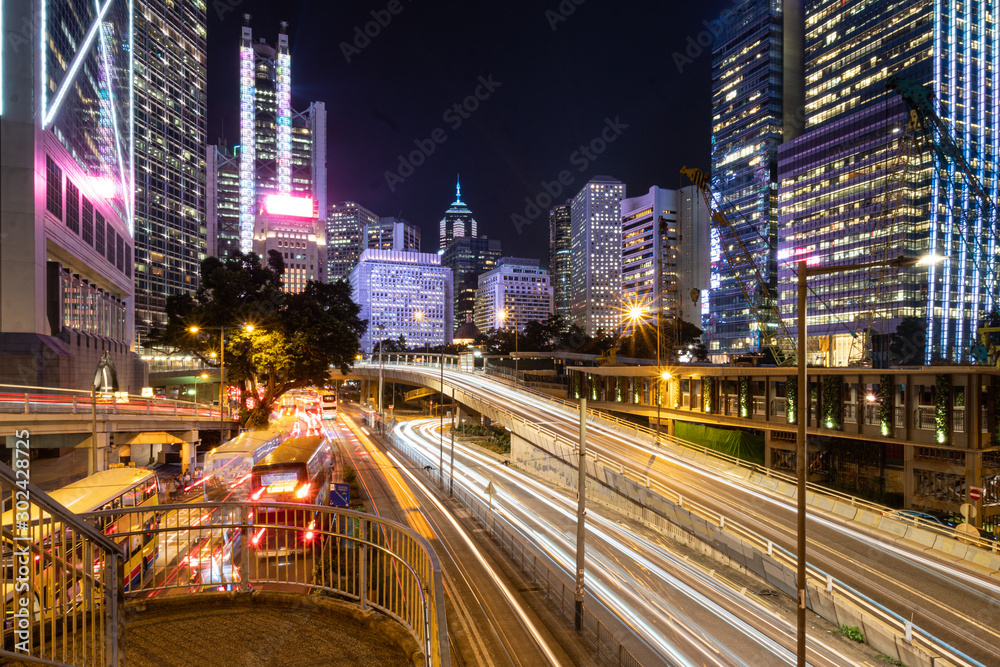 Traffic light trails captured in the Central business district in Hong Kong island at night in Hongkong