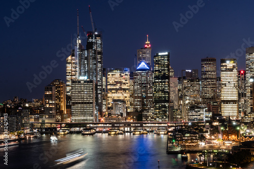 Twilight over the famous Circular Quay ferry terminal and the business district skyline in Sydney in Australia largest city