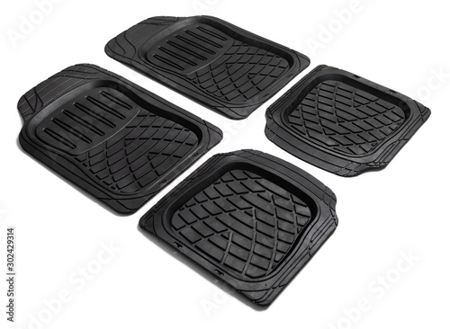Black rubber car mats isolated on white background.