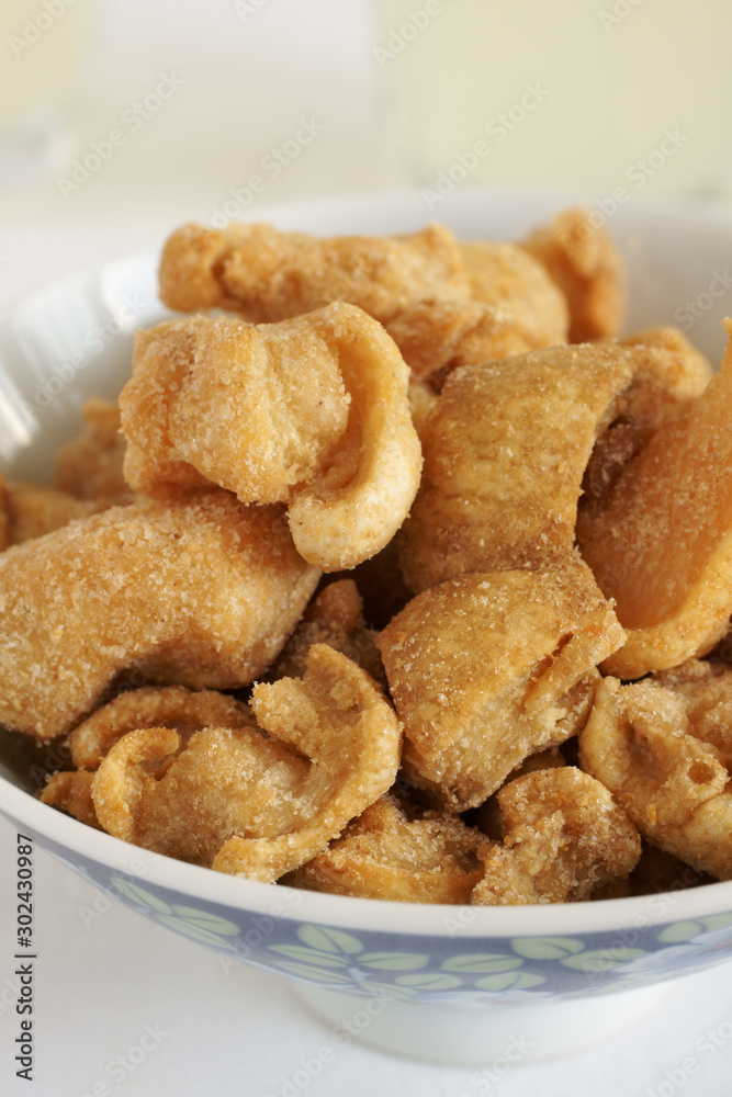 Pork scratchings deep fried pork rinds a popular snack Pork scratchings deep fried pork rinds a popular snack
