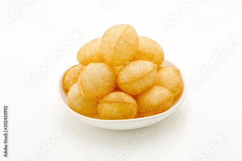 The Traditional Indian food named Pani puri or Golgappe, Sev Puri, Chat, bhel puri, Panipuri, Golgappa is a common street snack from India. - Image